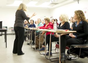 Lynn Harvey, Santa Monica College ESL instructor, helps adult education students learn English