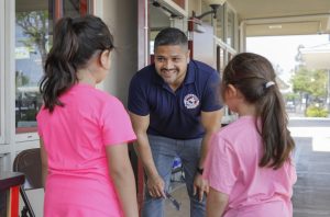 Victor Dominguez speaks to students at Bostonia Language Academy.