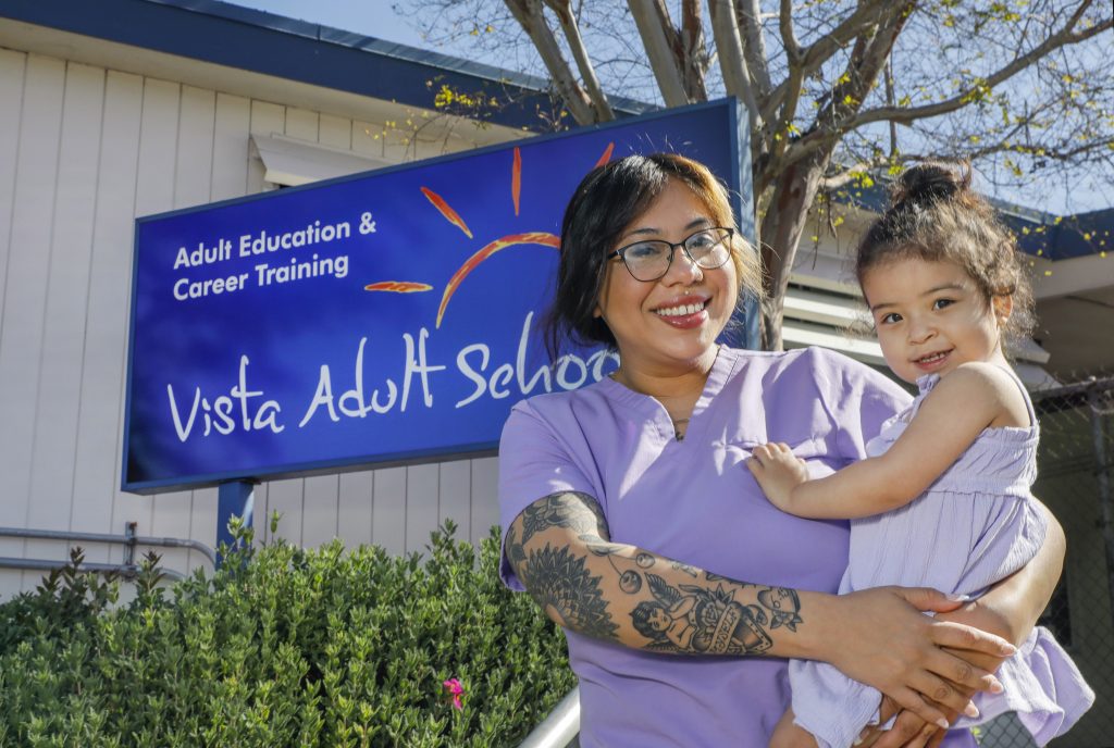 Portrait of Daisy Morales with her 2 year old daughter Paola at Vista Adult School