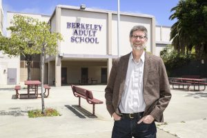 Berkeley Adult School Principal Thomas Reid stands in front of the school, which has a history dating back to 1881.