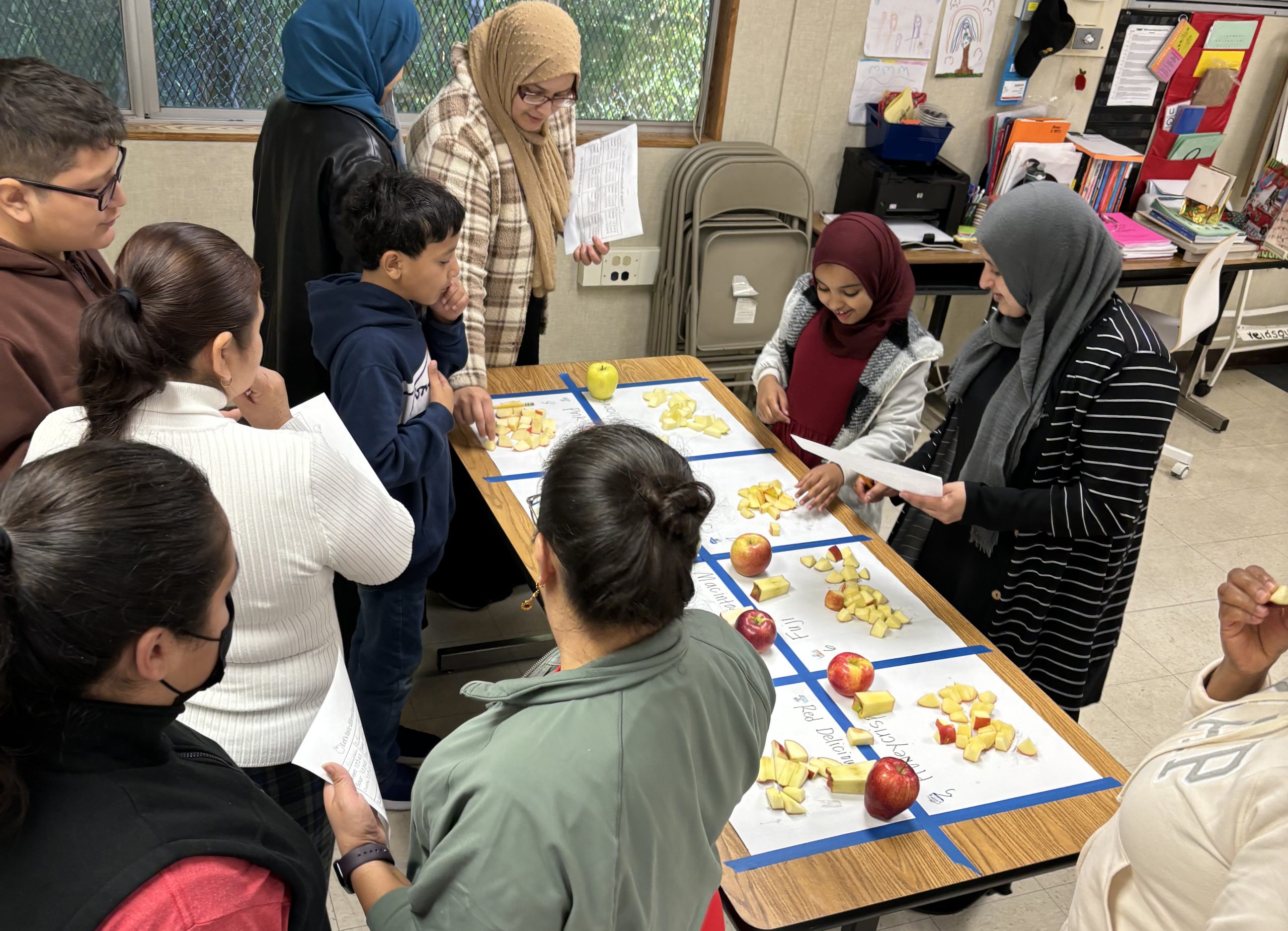 Adults and children learning English together in a family literacy class