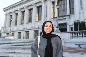 Aneesa Mustafa standing outside and smiling for the camera