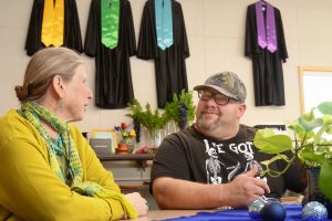 Thomas Moran, right, speaks with his former teacher Lynn Maxwell, at the Lompoc Adult School.