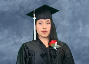 Graduation photo of Monica Rodriguez in a black cap and gown