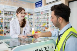 Engineer pays for drug purchases with credit card with the pharmacist in the pharmacy