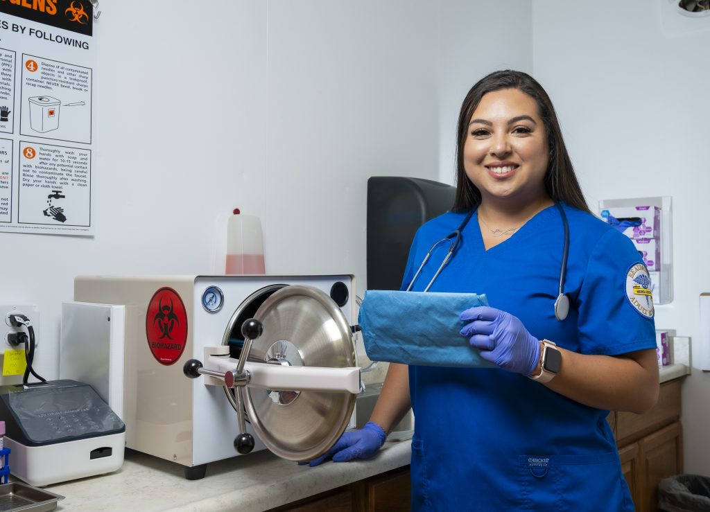 Samantha Precie standing in front of medical equipment