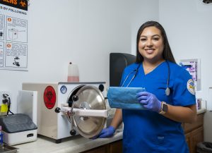 Samantha Precie standing in front of medical equipment