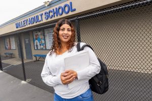 Nebila Abdullahi standing in front of the adult school