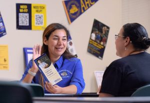 Dayana Zepeda, a non-credit counselor and teacher at the Santa Ynez center for Allan Hancock College’s Adult Education Program, helps ESL student Angelica Ruiz Acosta in her office.