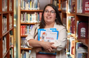 Denise Martinez in the Hancock school library