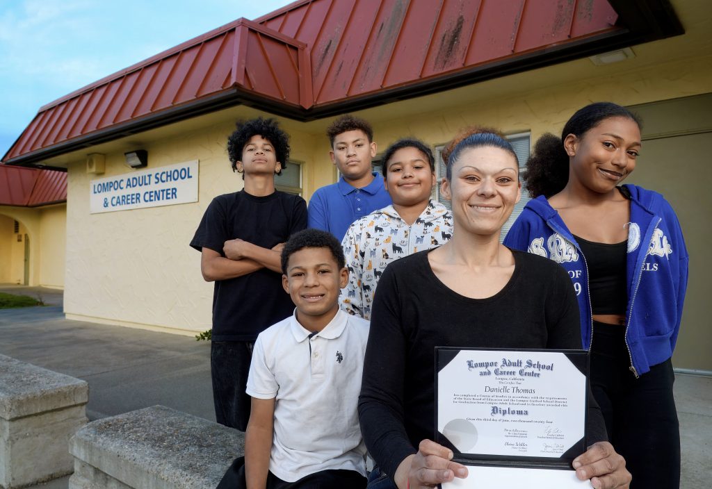 Danielle Thomas is shown at the Lompoc Adult School and Career Center. From left to right is her neighbor Jarrell, 14, (in black) and her children Jeremiah, 8, Mike, 14, Janelle, 9, and Kitana, 13