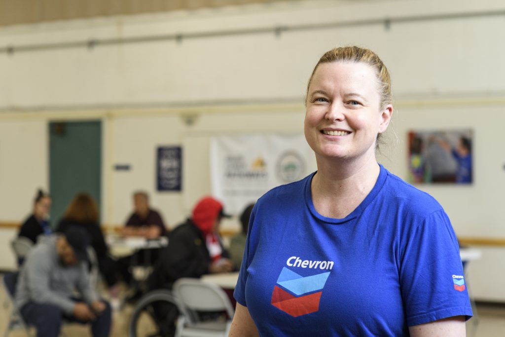 Erin McGregor smiling and wearing a Chevron company shirt